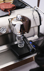 Barista Operating Espresso Machine