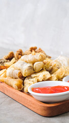 Nusantara Platter: A Flavorful Feast of French Fries, Crispy Fried Chicken Skin, Fried Mushroom, and Bakso Tahu Special with Delicious Condiment Sauces