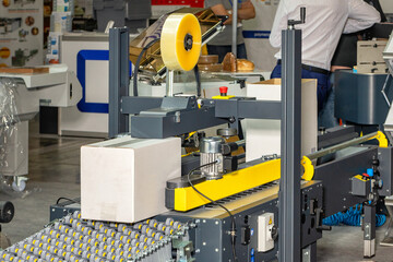 Fragment of an automatic packaging conveyor production line.