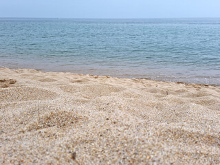 Fototapeta na wymiar Soft beautiful ocean wave on sandy beach. Beach landscape.