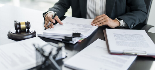Lawyer businessman working with lawbook in office or courtroom Legal counsel with gavel and legal...