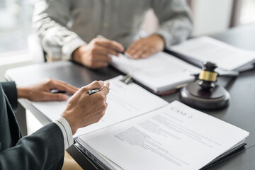 Lawyer Legal counsel presents to the client a signed contract with gavel and legal law. justice and...