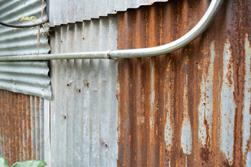 Industrial rusty background old grunge rusty zinc wall for textured background old rusty galvanized rust and scratched steel texture corrugated iron siding vintage background