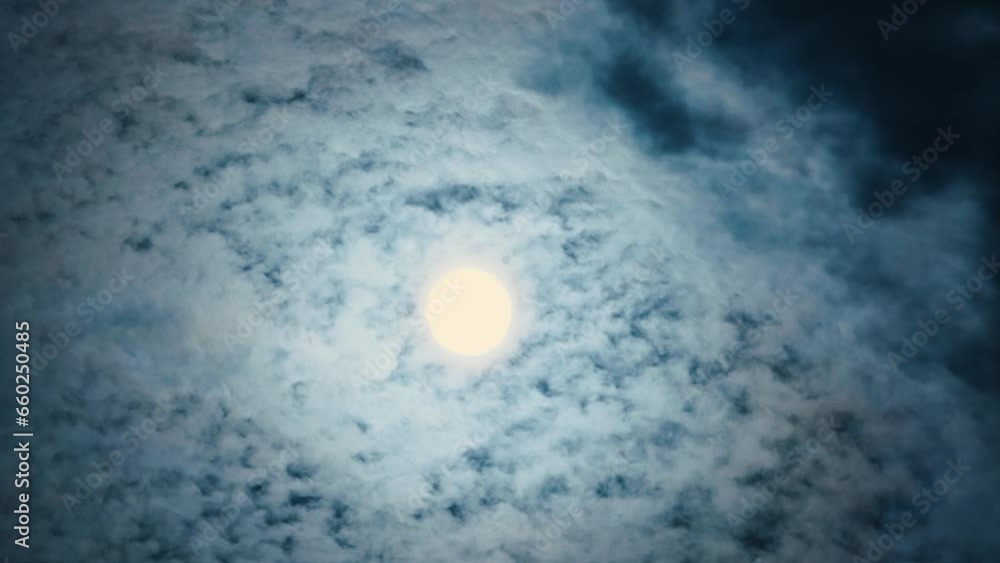 Poster full moon with clouds scattered by wind in mid autumn. bright moon moving across the sky covered by 
