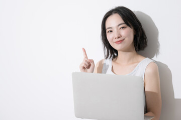 Naklejka premium Woman using a computer Woman pointing and making a recommended pose