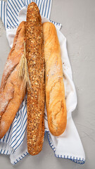 Fresh baguette bread on light background. Traditional French food