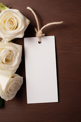 Wedding tag mockup with white flower on wooden background