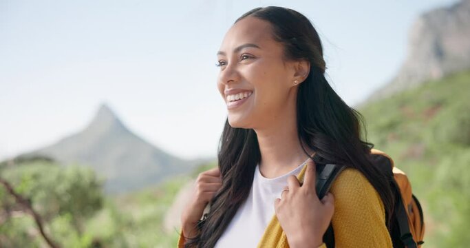 Hiking, nature and woman on mountain for adventure, trekking and freedom with backpack. Travel, walking and happy person smile outdoors for wellness, journey and exercise on holiday or vacation