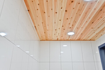 In a multipurpose room with a lot of humidity, it is best to use cypress wood for the ceiling to...