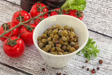 Marinated green capers in the bowl
