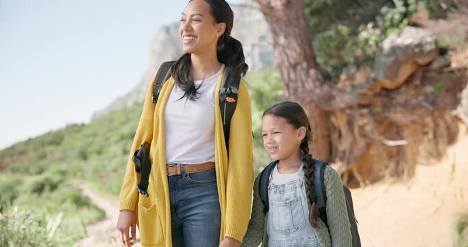 Hiking, mother and girl with adventure, health and happiness with vacation, weekend break and bonding. Pointing, mama and child with journey, fitness and conversation with nature, forest and smile