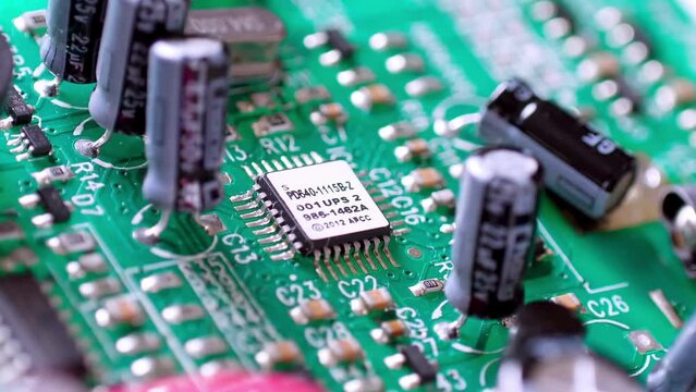 Zooming out of an assembled PCB, Printed Circuit Board complete with all its components.