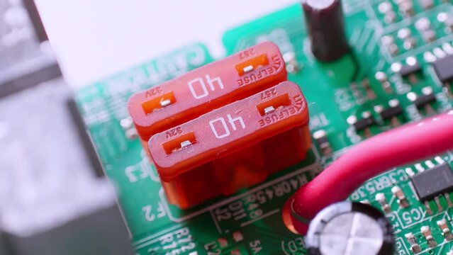 A close up and a zoom out of the terminal blocks on a circuit board.