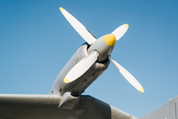 Military aircraft propeller against a blue sky