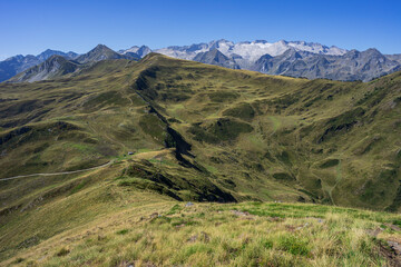 hikers in front of the Maladeta massif, Montcorbison, Aran Valley, Lérida province, Spain
