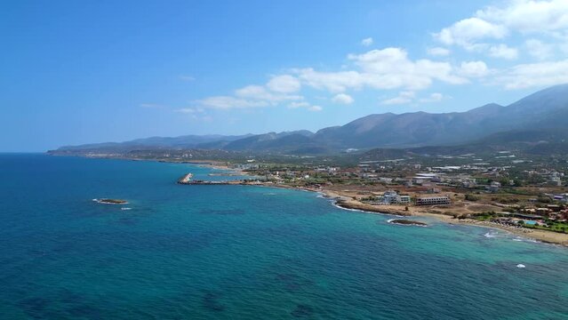 Aerial View Of A Cute Little Island With A Little Chapel. City Of Malia In Crete