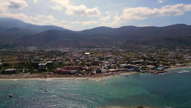 Aerial View Of A Cute Little Island With A Little Chapel. City Of Malia In Crete