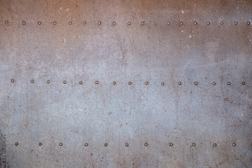 Iron background decorated with gray nails