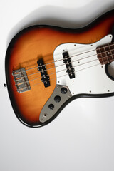 Fototapeta premium Brown guitar on white background. Music wallpaper