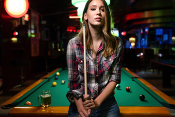 Portrait of beautiful young woman in billiard club