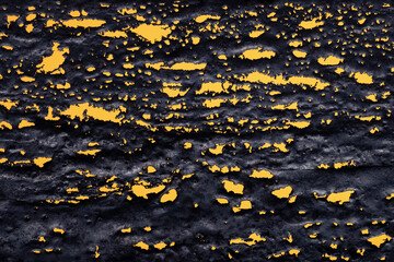 Scale on a yellow background. Abstract background, texture, wallpaper. Waste from hot metal pouring.