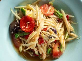 top view Som Tum, Thai green papaya salad with salted crab