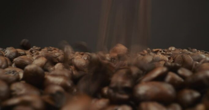 Coffee beans fly over with scope lens macro with falling beans