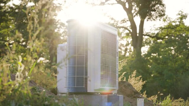 Heat pump outdoor unit in the afternoon sun