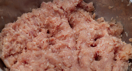 minced pork close-up in an iron bowl