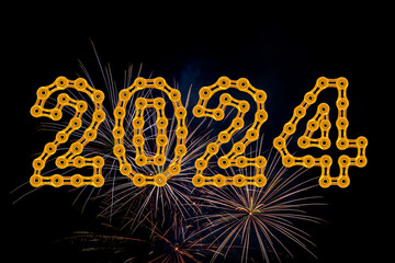 A fireworks display against the night sky with 2024 Happy New Year made from golden chain links