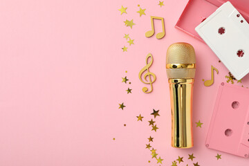 Golden microphone with notes on a light background.