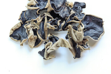 Dried black mushroom isolated on white background. Chinese black fungus or tree black muer fungus.