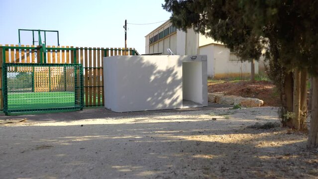 Mobile bomb shelter near a soccer field in kibbutz in Israel