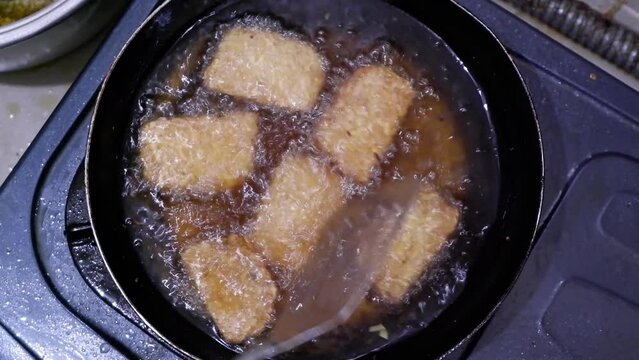 the process of cooking tempeh at home, Indonesia's favorite traditional dish derived from soybeans. Indonesian street food.