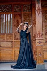 Obraz premium Women's fashion model. Female makeup model. Asian woman. Indonesian women. wearing a black wedding dress. Black wedding dress.