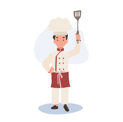 Adorable Little Chef Boy in Apron. Smiling Child Chef with Flipper