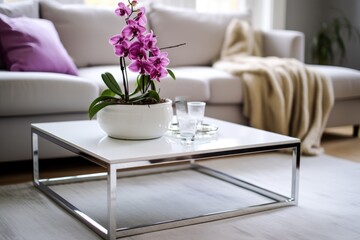 an orchid on a white coffee table