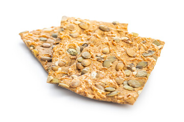 Knackebrot with pumpkin seeds. Wholegrain crispbread isolated on white background.