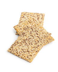 Knackebrot with sesame seeds. Wholegrain crispbread isolated on white background.