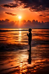Fototapeta na wymiar The silhouette of a young boy stands in a posture of prayer and adoration against the backdrop of a breathtaking sunset over the sea. The golden hues of the sun's descent cast a warm glow on the water