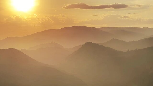 Mountains landscape on sunset. Mountain view from peak Mola De Segart mountain in Sierra Calderona national park. Sunset over Golden Hills mountains. Landscape of a mountain valley. Hiking in mountain