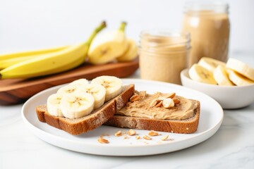 toast with almond butter and sliced bananas on a plate