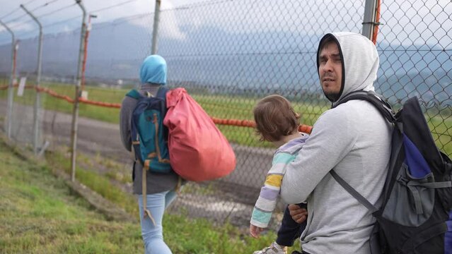 a refugee family runs Illegal Border crosser problem undocumented person close up
