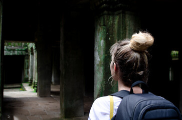 Tourist Woman In Ta Prohm temple located in Angkor, Siem Reap, Cambodia