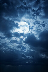 Obraz na płótnie Canvas A large full moon in a cloudy sky