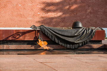 MOSCOW, RUSSIA - SEPTEMBER 26, 2023: Eternal flame at the grave of the Unknown soldier at the walls...