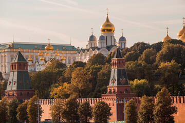 Fototapeta na wymiar MOSCOW, RUSSIA - SEPTEMBER 26, 2023: View of Moscow on an autumn evening at sunset. Kremlin towers. The Grand Kremlin Palace, the Assumption and Annunciation Cathedrals. A popular tourist attraction.