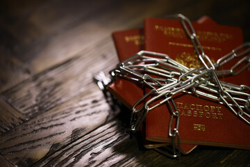 Russia Sanctions and banned russian people, Russian Federation passports with padlock and chain....