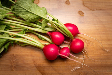 Organic gardening, fresh radish on the cutting board, Health nutritional food. Food preparation.