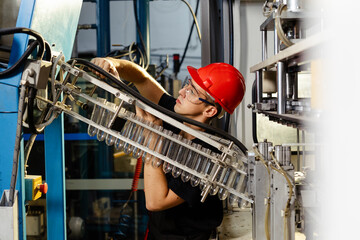 Workshop with extruders for the production of plastic bottles